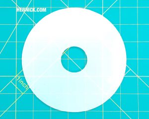 White plastic bearing for Rotary SM18 lifts on a green background with yellow grid markings.