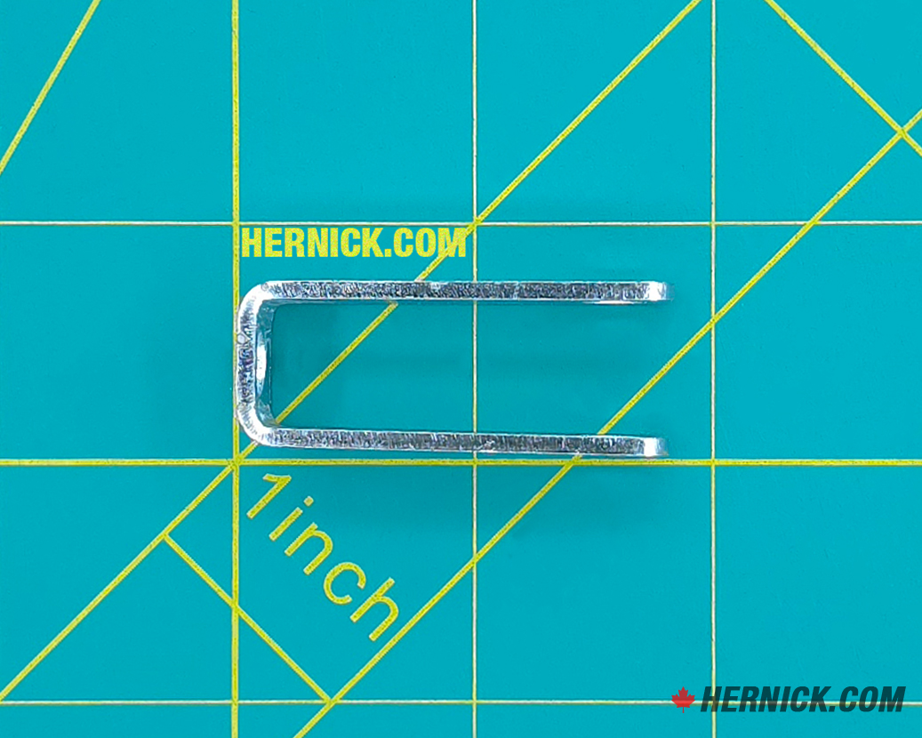Top view of a rotary clevis on a green background with yellow grid markings