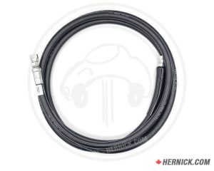 Coiled black reinforced hydraulic hose with crimped hydraulic fittings on both ends