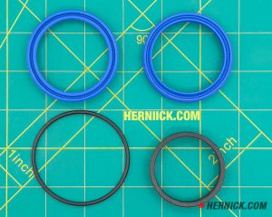 Seal kit containing 2 blue seals and 2 dark coloured seals.