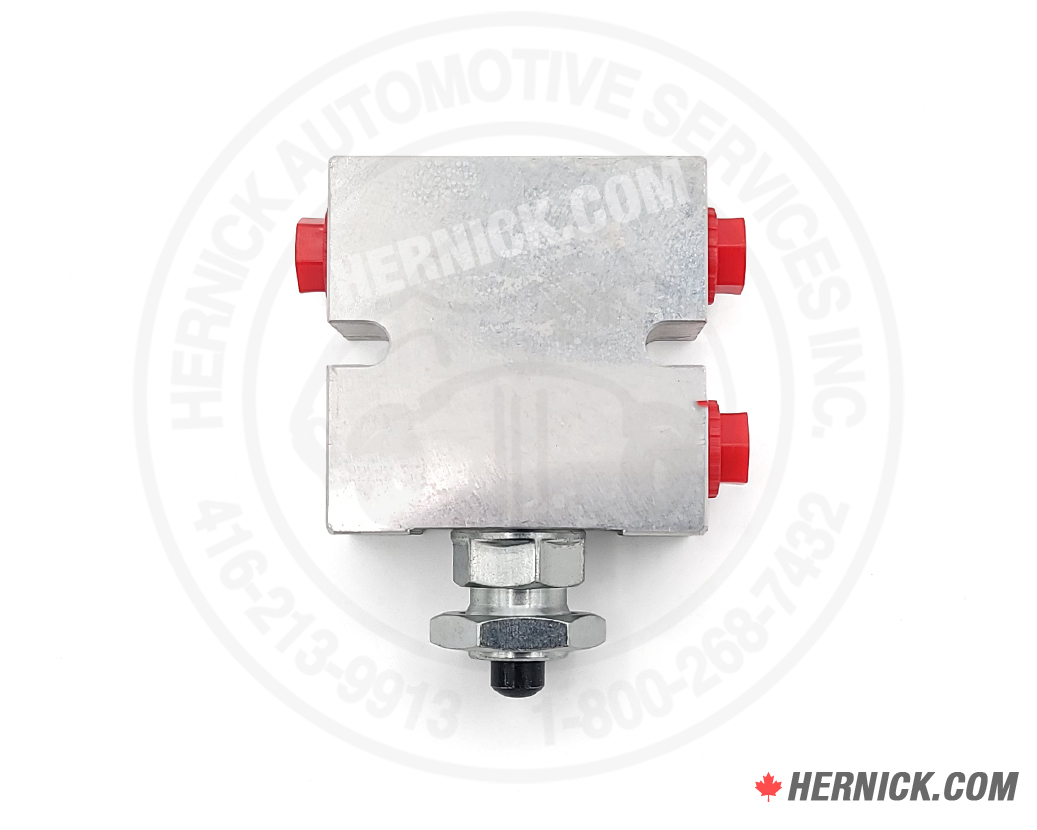 hydraulic manifold valve made from steel with 3 red threaded ports