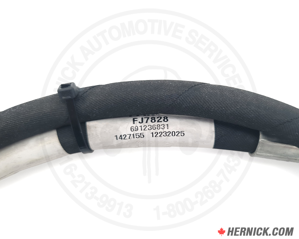 Close up of a rotary hydraulic cable and an OEM label reading FJ7828.